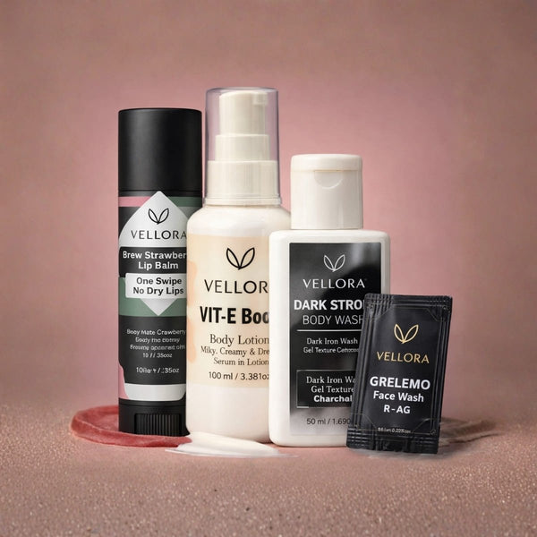 Vellora Bold & Berry Travel Kit featuring Vit-E Boost body lotion, Brew Strawberry lip balm, charcoal body wash, and Grelemo face wash for travel-friendly skincare