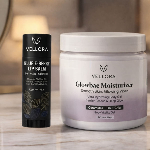 VELLORA Glowbae Moisturizer jar with ceramides, hyaluronic acid and chia placed beside VELLORA Blue E-Berry Lip Balm, showcasing a hydrating skincare and lip care combo for smooth, nourished skin and soft lips.