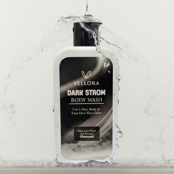 Vellora Dark Strom Body Wash in hand under running water, 3-in-1 charcoal gel cleanser for face, body and hair, deep cleansing body wash for sweat, odor and oil control in Indian climate.