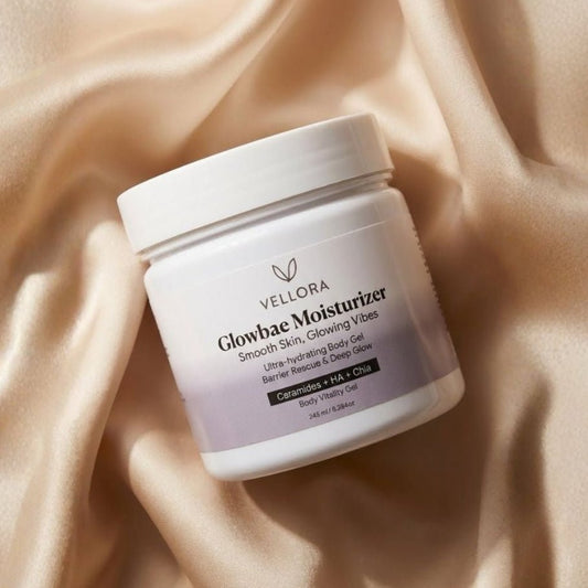 Vellora Glowbae Moisturizer jar on soft satin background, ultra-hydrating body gel moisturizer with ceramides and hyaluronic acid for smooth, glowing and deeply nourished skin.