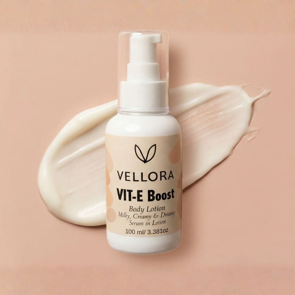 Vellora VIT-E Boost Body Lotion bottle with creamy lotion texture showing lightweight, milky serum-in-lotion consistency for deep hydration and glow